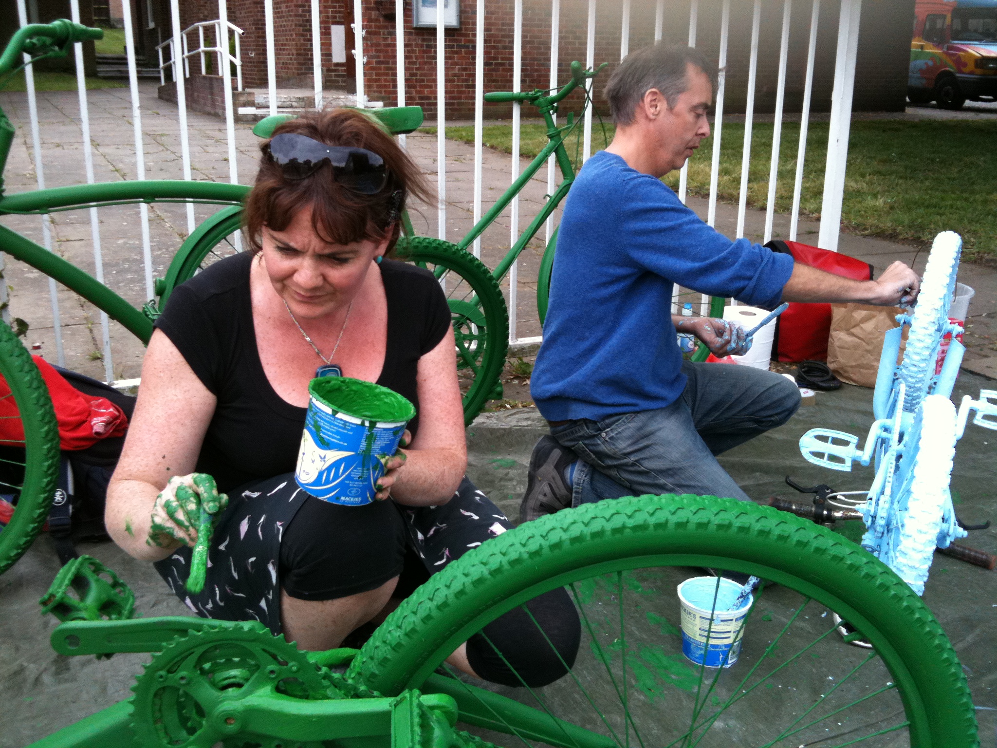 Maria and Ray paint bikes tree green and sky blue