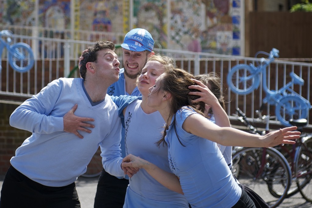 Two performers interrupted just before a kiss