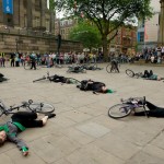 All performers and their bikes lie on the floor, after 'the crash'